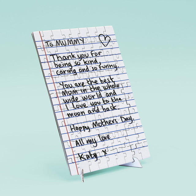 Personalised letter jigsaw puzzle by Pikkii on stand with Mother's day letter to Mummy on blue background