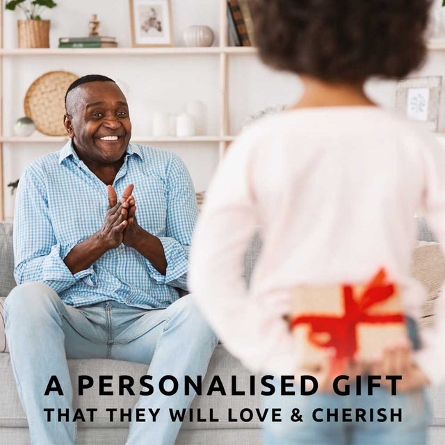 A girl giving a personalised gift jigsaw puzzle to her Dad