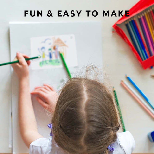 over head camera shot of Child drawing on shrinkable canvas with message fun & easy to make Piikkii Kids Drawing Shrink keyring Kit