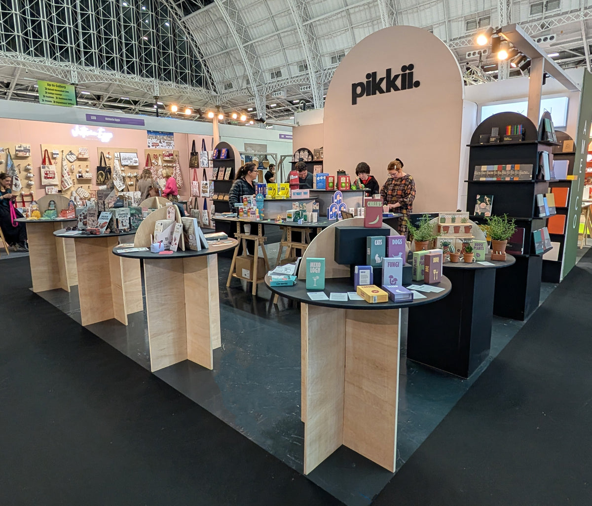 The Pikkii stand at a trade show, with our gifts and games on display